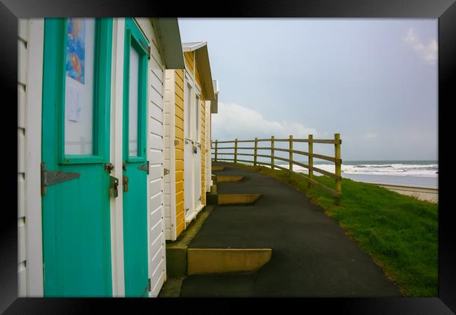 Beach Huts, Colored Chalets Framed Print by Dave Bell