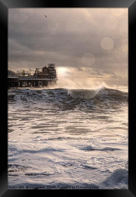 Brighton Pier on Stormy day Framed Print by Gary Lane