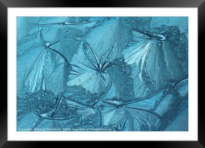 Frost pattern of ice flowers on window Framed Mounted Print by Bernd Tschakert