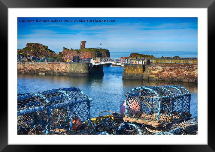 Lobster pots at Dunbar Castle Framed Mounted Print by Angela Wallace