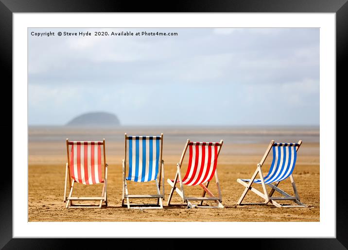 Colourful wooden deck chairs on a beach Framed Mounted Print by Steve Hyde