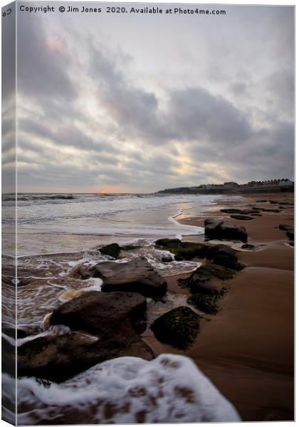 Sunrise over the beach at Whitley Bay Canvas Print by Jim Jones