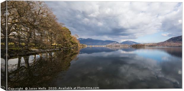 Trees and mountains reflect in Derwent Water Canvas Print by Jason Wells