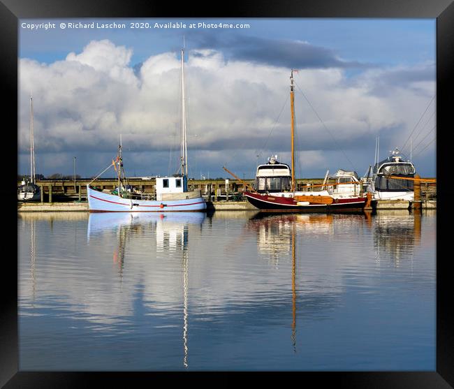 Fishing ships in harbour Framed Print by Richard Laschon