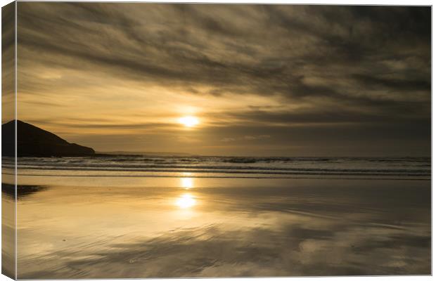 Moody sunset beach reflections Canvas Print by Tony Twyman