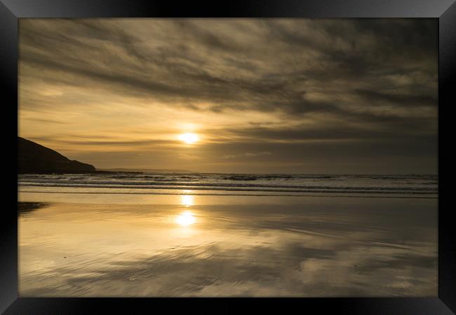Moody sunset beach reflections Framed Print by Tony Twyman