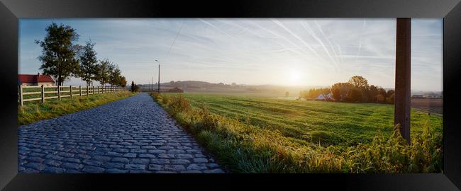 paving sett roadin autumnal sunlight Framed Print by youri Mahieu