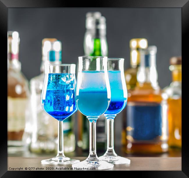 Colorful drink on the background of bottles in ori Framed Print by Q77 photo