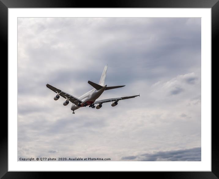 Passenger plane flying in the blue sky with clouds Framed Mounted Print by Q77 photo