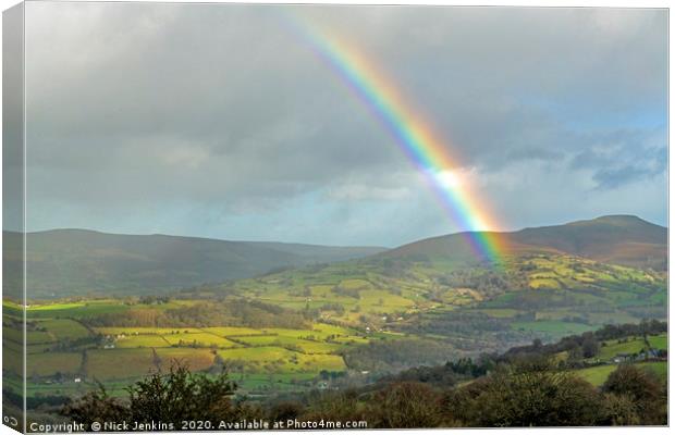 A Rainbow and the Sugarloaf Brecon Beacons Canvas Print by Nick Jenkins