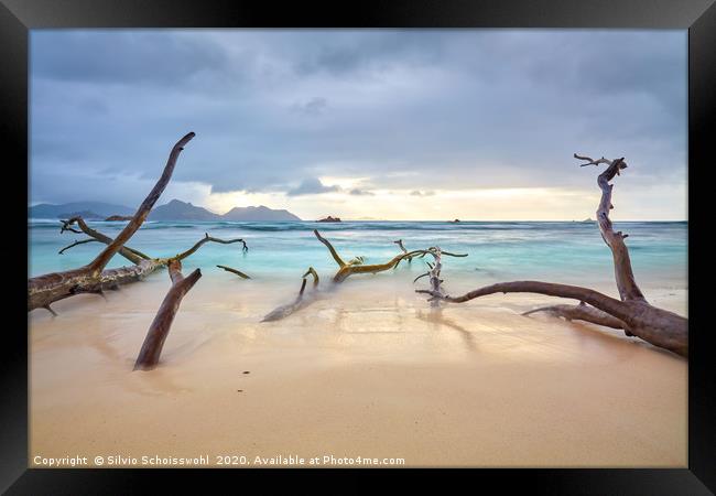 Clouds over a natural sandy beach on La Digue Framed Print by Silvio Schoisswohl