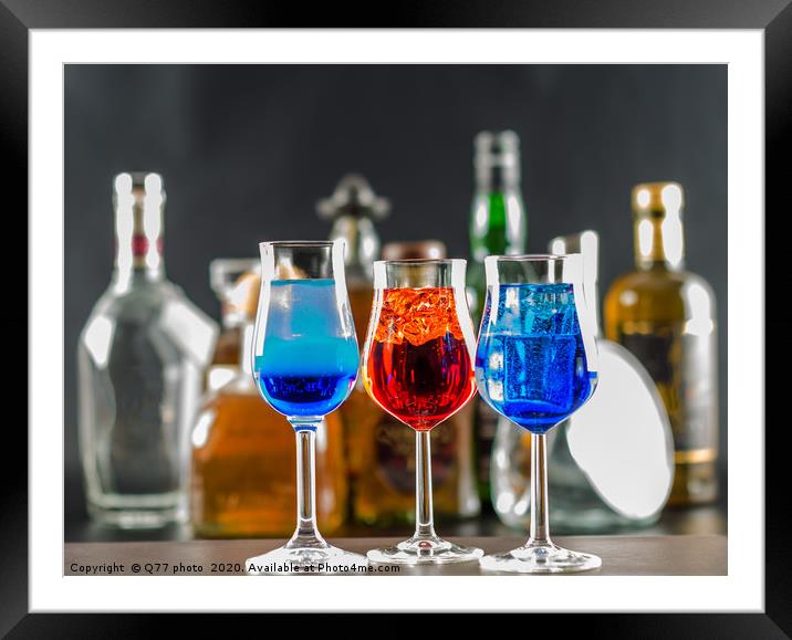 Colorful drink on the background of bottles in ori Framed Mounted Print by Q77 photo