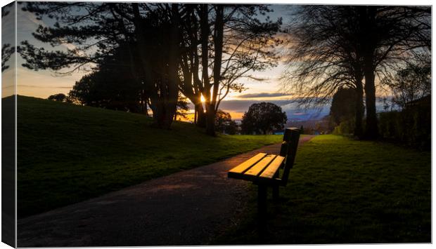 Sunset and a park bench Canvas Print by Leighton Collins