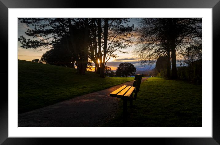 Sunset and a park bench Framed Mounted Print by Leighton Collins