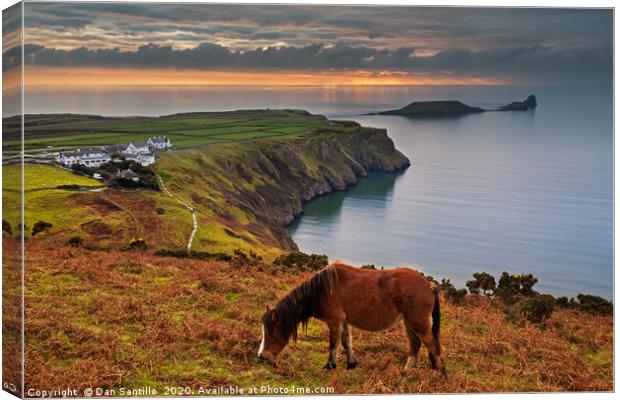 Sunset over Worms Head, Rhossili Bay Canvas Print by Dan Santillo