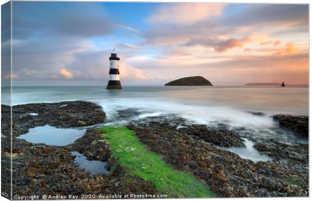 Penmon Lighthouse at sunrise Canvas Print by Andrew Ray