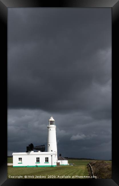 Dark sky behind Nash Point Lighthouse  Framed Print by Nick Jenkins