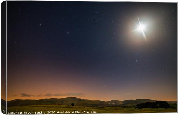 The moon and stars over Pen y Fan and Corn Du Canvas Print by Dan Santillo