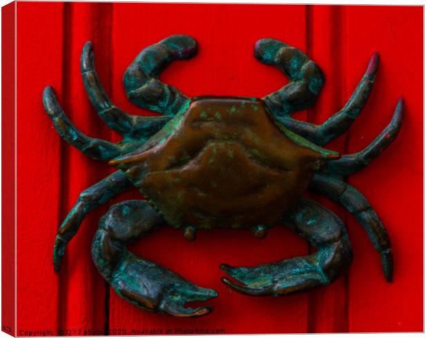 Brass crab knocker, knocker on red wooden door, de Canvas Print by Q77 photo