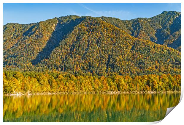 Autumn colored trees reflecting in a lake  Print by Christian Pauschert