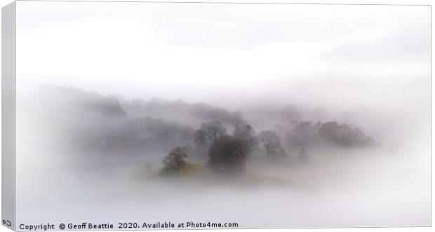 Trees in the mist, The lake district Canvas Print by Geoff Beattie