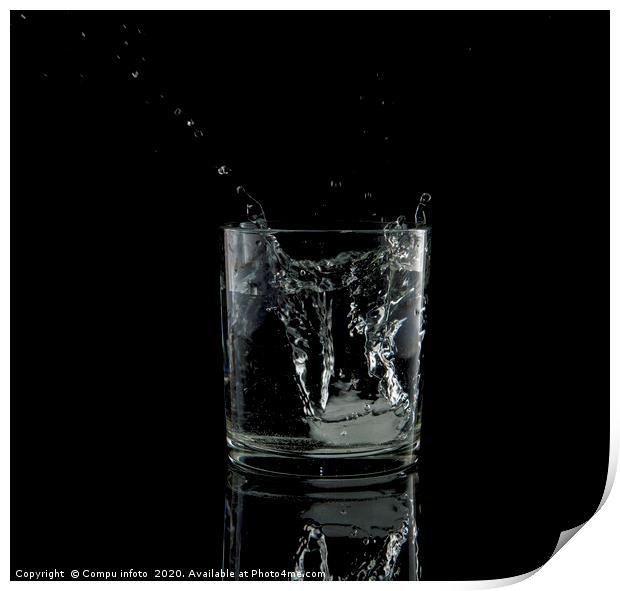 splash from a falling ice cube in glass of water Print by Chris Willemsen