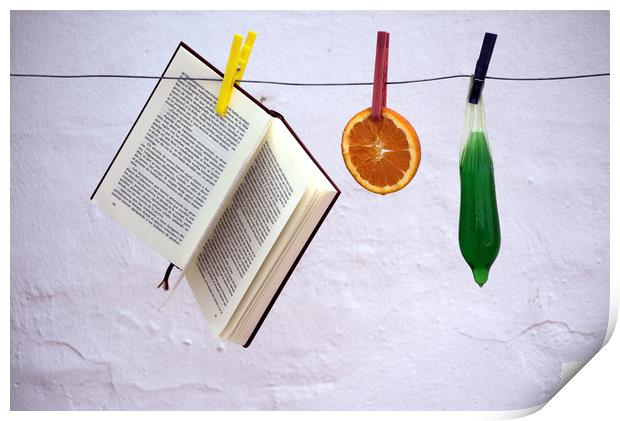 This is a still lfe made with an orange, a book an Print by Jose Manuel Espigares Garc