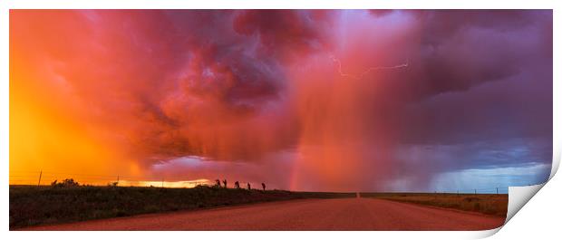 Sunset thunderstorm with rainbow and lightning. Print by John Finney