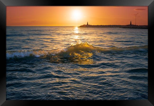 Sunrise over sea waves Framed Print by Jordan Jelev