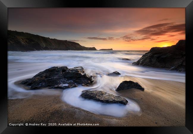 Sunset over Polrurrian Cove Framed Print by Andrew Ray