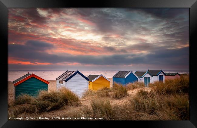 Southwold beach huts at sunrise Suffolk Framed Print by David Powley