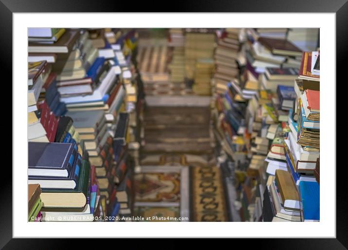 Stack of old books, selective focus. Framed Mounted Print by RUBEN RAMOS