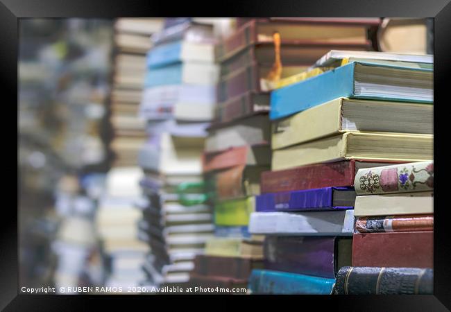 Close-up of stacks of old books, selective focus. Framed Print by RUBEN RAMOS