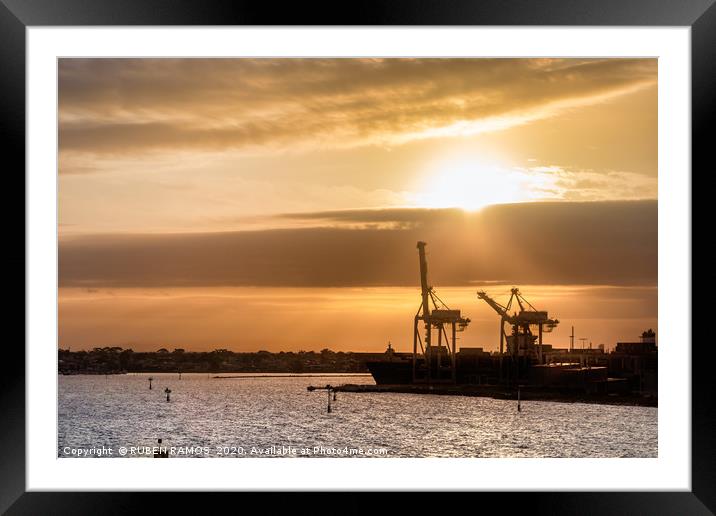 Ships and cranes silhouettes at the Melbourne Port Framed Mounted Print by RUBEN RAMOS