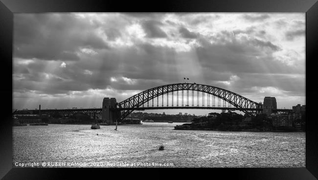 The Sydney Harbour Bridge under clouds.  Framed Print by RUBEN RAMOS