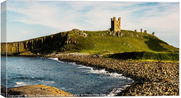 Dunstanburgh in the Afternoon Sun Canvas Print by Gary Clarricoates
