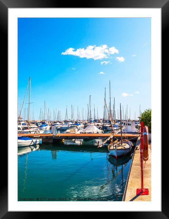 Beautiful luxury yachts and motor boats anchored i Framed Mounted Print by Q77 photo