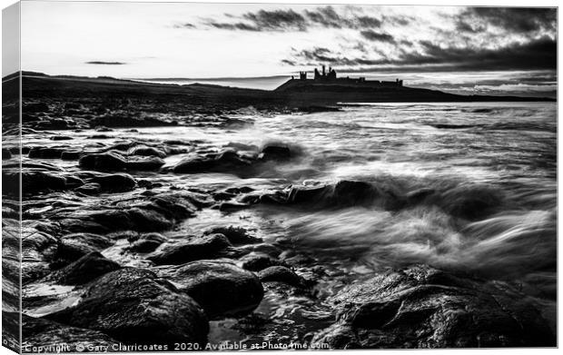 Mood at Dunstanburgh Canvas Print by Gary Clarricoates