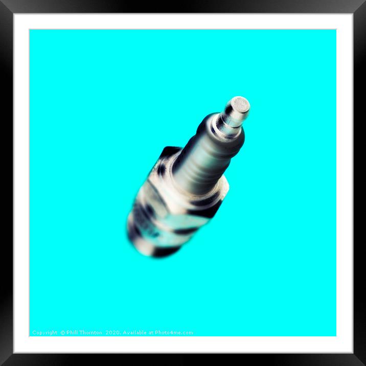 Abstract view of a spark plug on light blue Framed Mounted Print by Phill Thornton