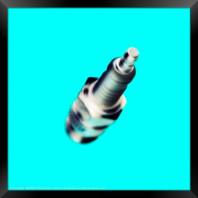 Abstract view of a spark plug on light blue Framed Print by Phill Thornton