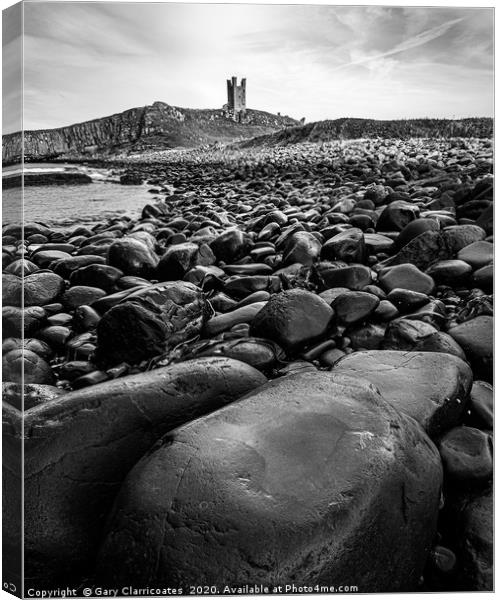 Dunstanburgh by the Rocks Canvas Print by Gary Clarricoates