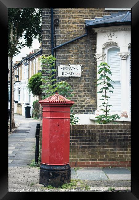 Red post box in Mervan Road, London Framed Print by Angela Bragato