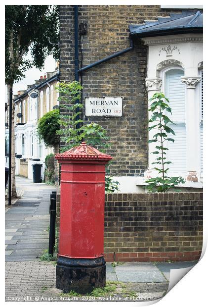 Red post box in Mervan Road, London Print by Angela Bragato