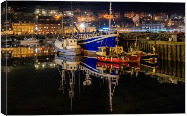 Whitby harbour at night Canvas Print by Janet Burdon