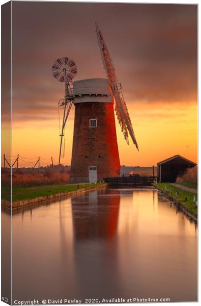 Winter sunset over Horsey Mill Canvas Print by David Powley