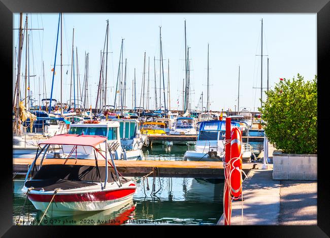 Beautiful luxury yachts and motor boats anchored i Framed Print by Q77 photo