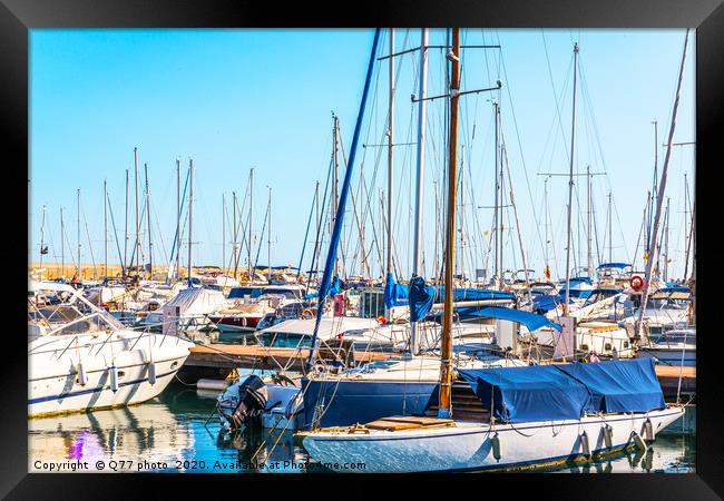 Beautiful luxury yachts and motor boats anchored i Framed Print by Q77 photo