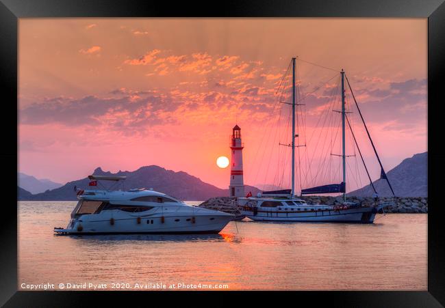 Lighthouse And Yacht Sunset Framed Print by David Pyatt