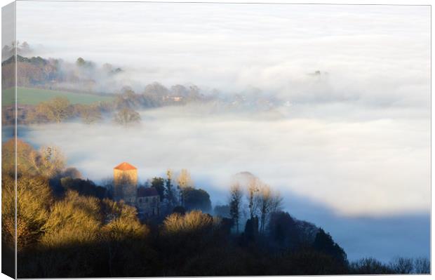 Looking down on Little Malvern Priory on a misty w Canvas Print by David Wall