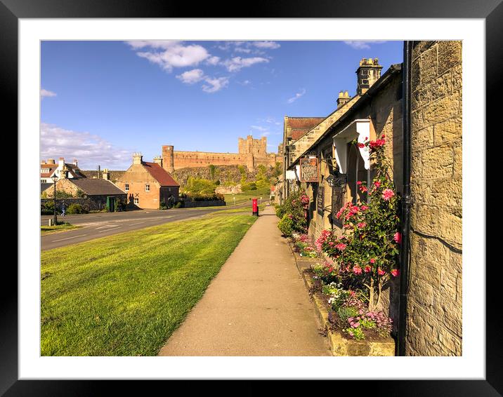 Bamburgh cottages and imposing castle Framed Mounted Print by Naylor's Photography